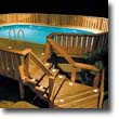 Picture of deck and stair lighting by a pool at night.