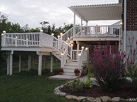 Decked out for the night. Deck lights turn this backyard deck into a night time party spot. 